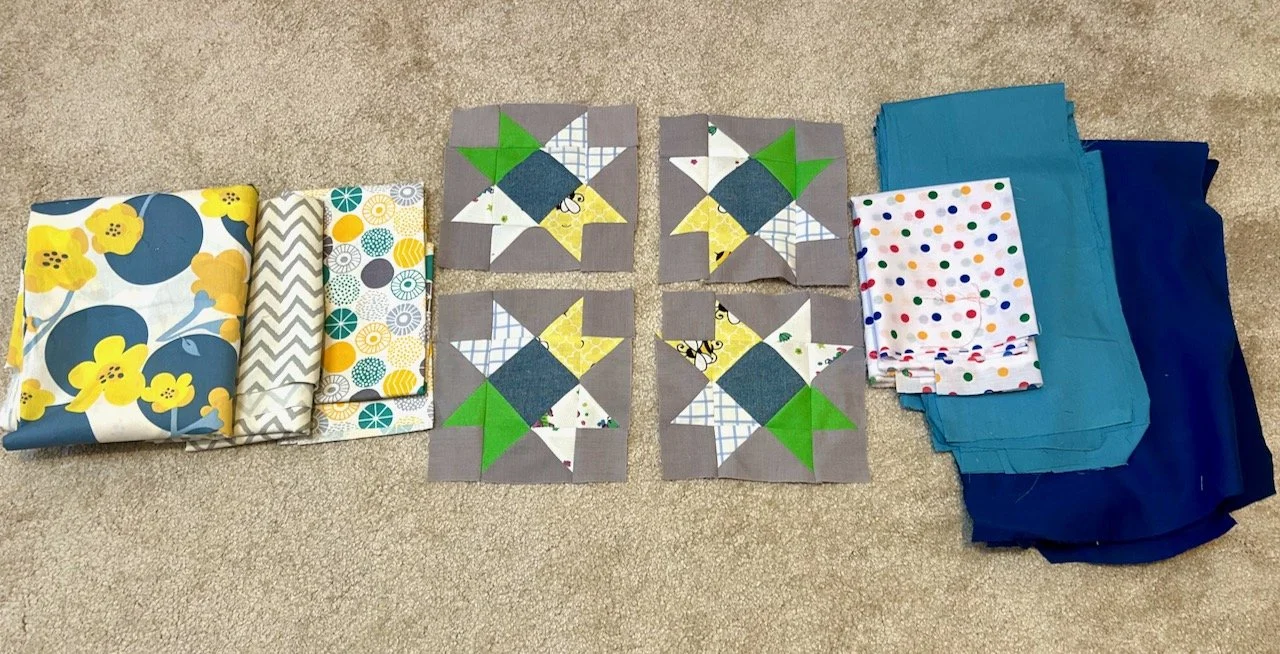 Adding the border fabrics to both sides of the four central star blocks