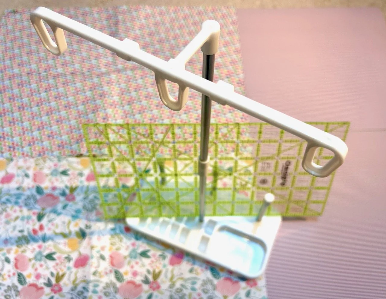 A standalone thread holder and half the size of my current ruler to take to sewing groups