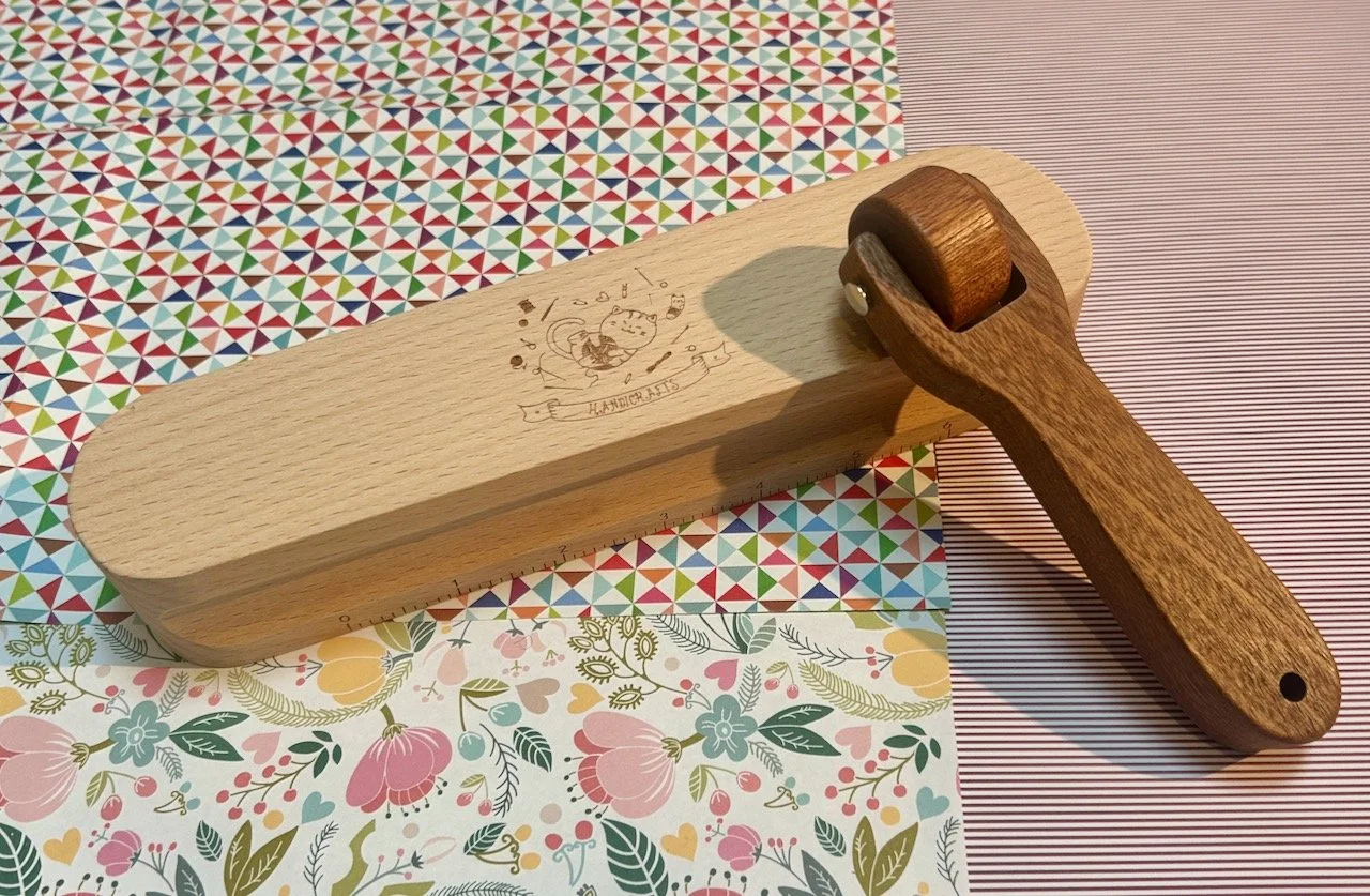 A wooden clapper and seam roller - for patchwork use