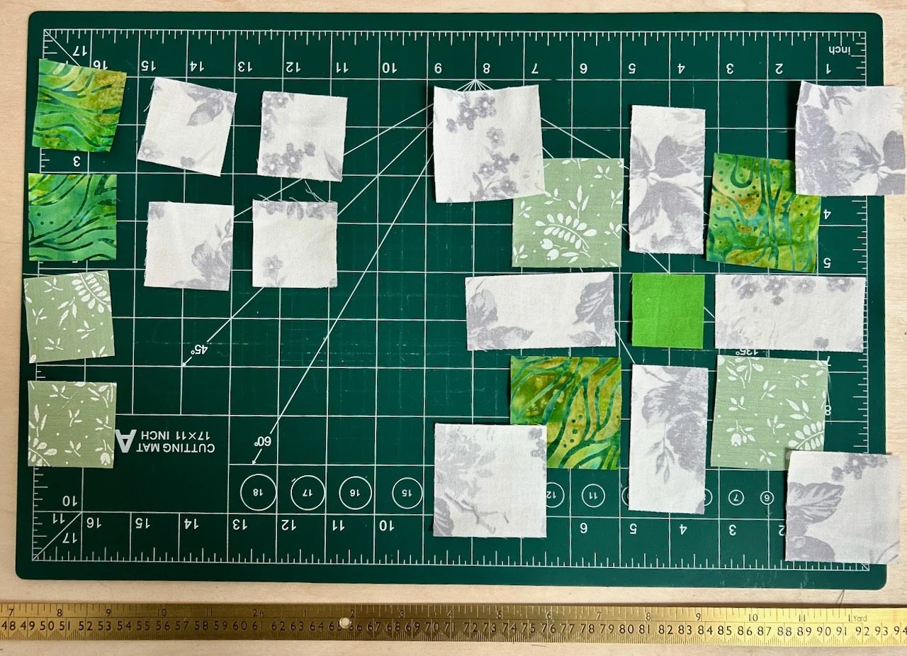Starting out wrongly with my first green star block - the pieces are all laid out but incorrectly!