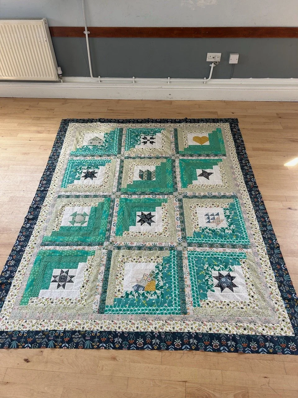 My finished mystery block of the month quilt top in the Edwinstowe village hall