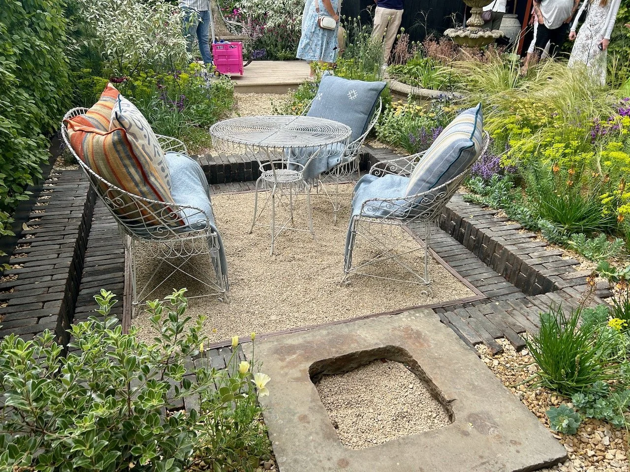 Stepping back to admire the sunken seated area, a potential firepit and the planting