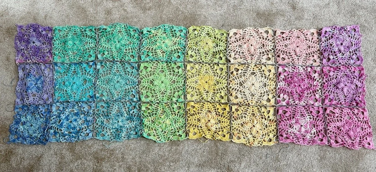 My rainbow squares attached to each other with a light grey chain stitch