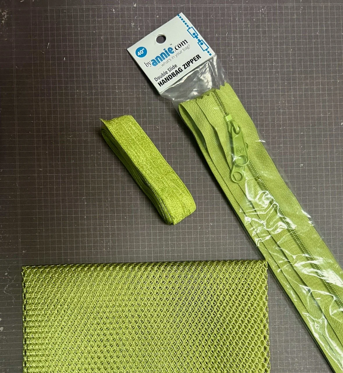 Apple green mesh, elastic and a zip - more bag supplies