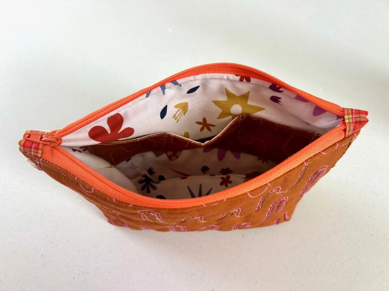 Looking inside the pouch at the three sectioned internal pocket