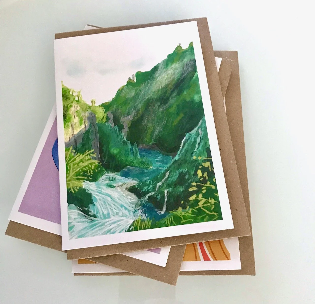 A STREAM THROUGH A LUSH VALLEY LANDSCAPE