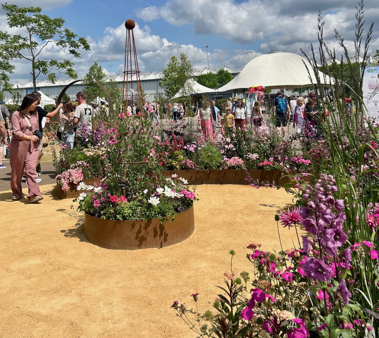 The designer, and stepping back to see more of the design - Think, all things pink - Gardeners' World Live 2025
