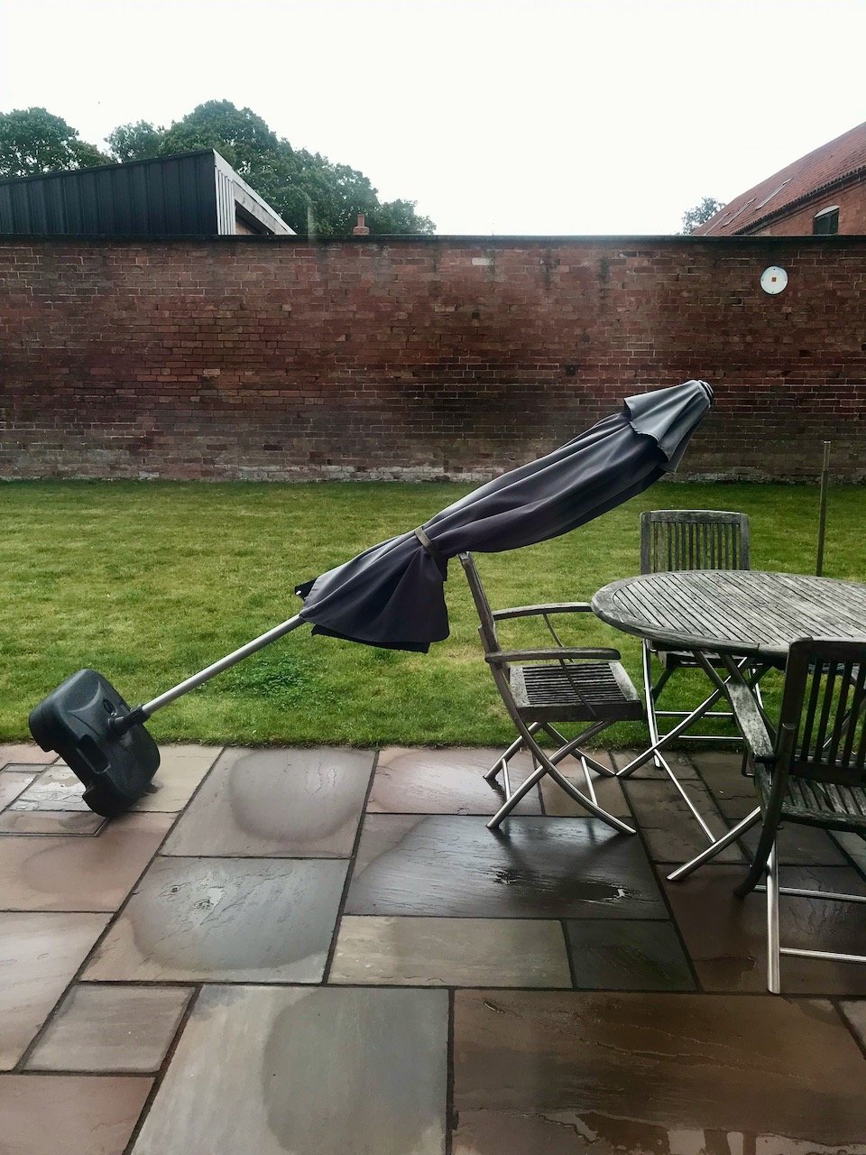 Whoops - umbrella down - caught by the table - it's been that windy here