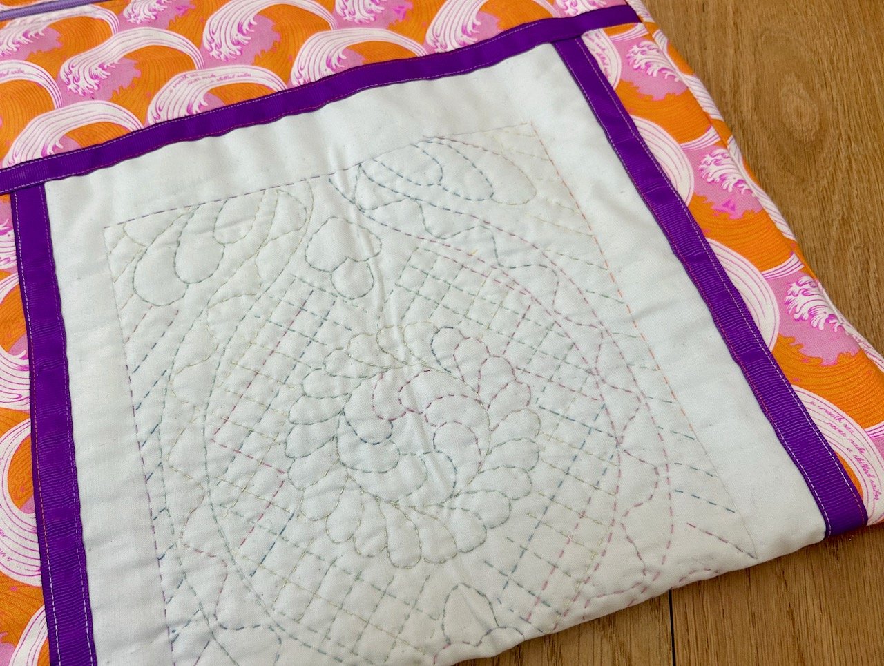 This much larger embroidery by mum uses coloured thread on the pattern which also continues on the back of the pouch