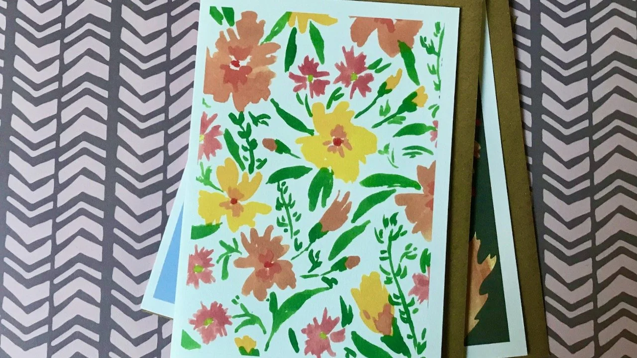 yellow and peach flowers with green leaves on a white background, both previous cards are at the bottom of the pile