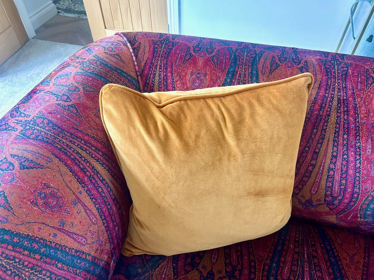 A sneak peek of my new sofa and cushions - paisley patterned velvet with orangey/gold scatter cushions