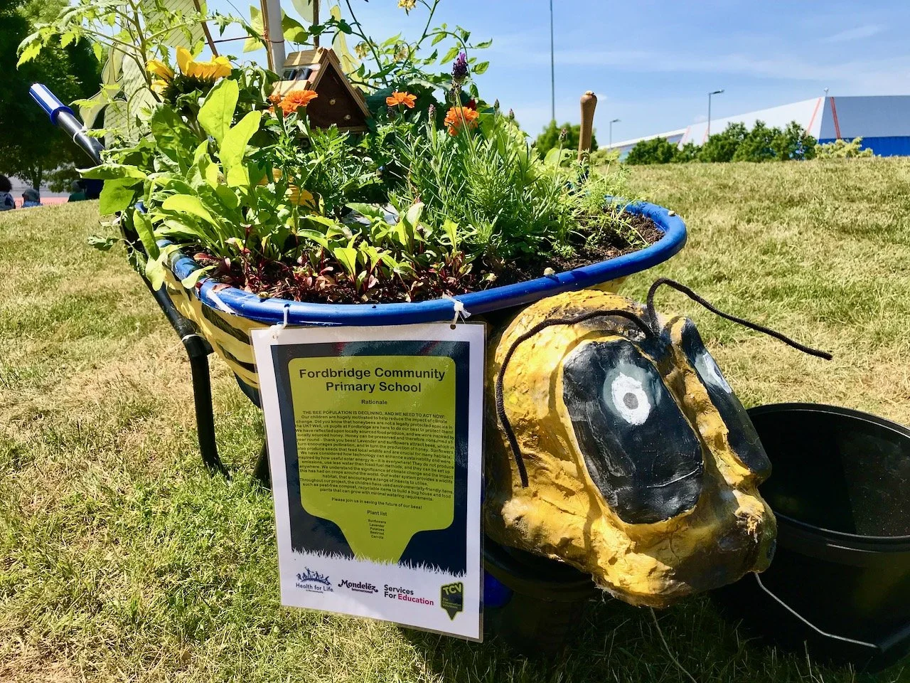 The Fordbridge Community Primary School wheelbarrow marking the decline of bees- hence the paper mache bee head on the front of the wheelbarrow