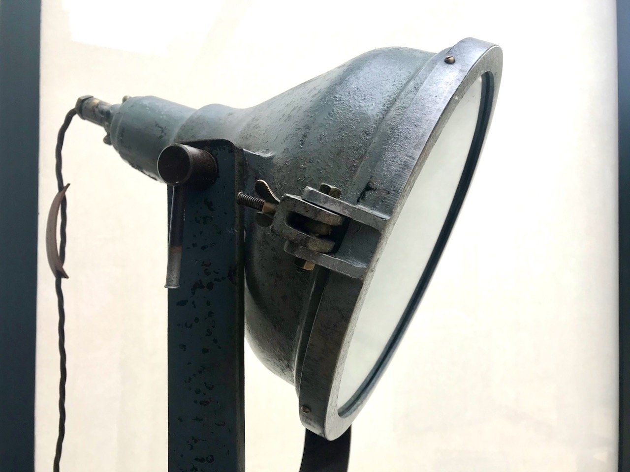 GEC industrial style light on a tripod stand in our conservatory