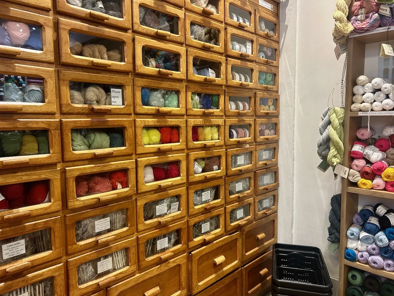 A wooden vintage shop unit - full of more wool