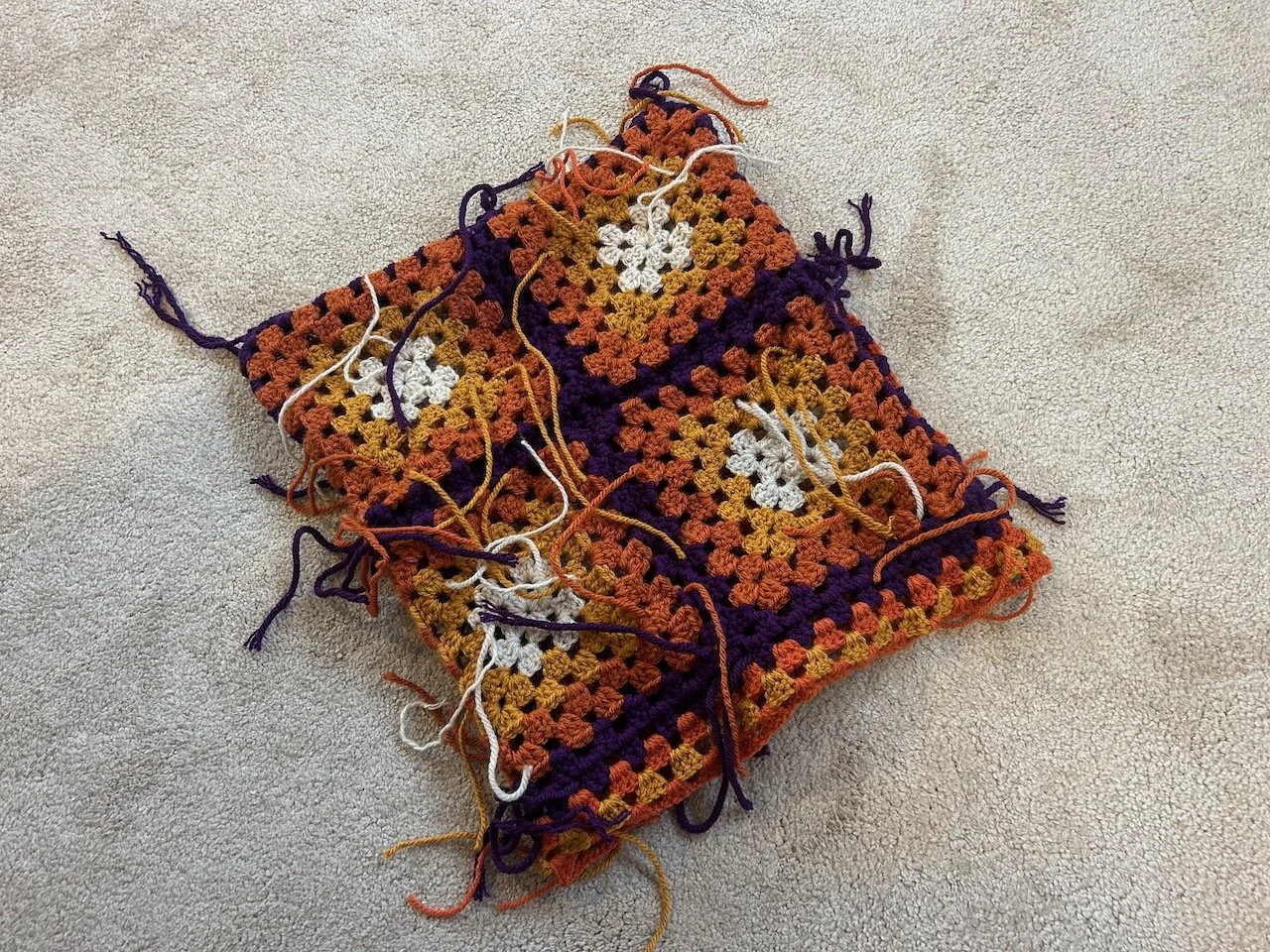 My crocheted granny squares joined together - the ends need sewing in