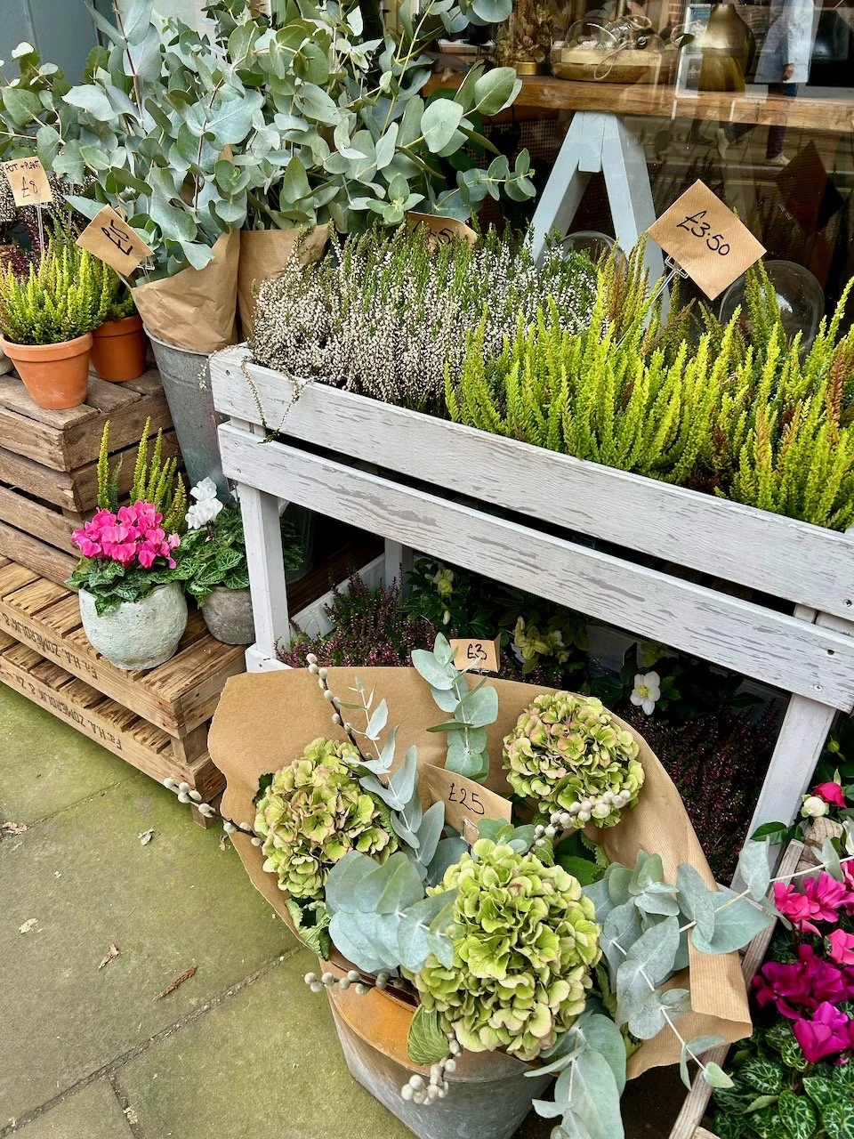 Autumnal flowers and floral arrangements outside a florist shop in Southwell