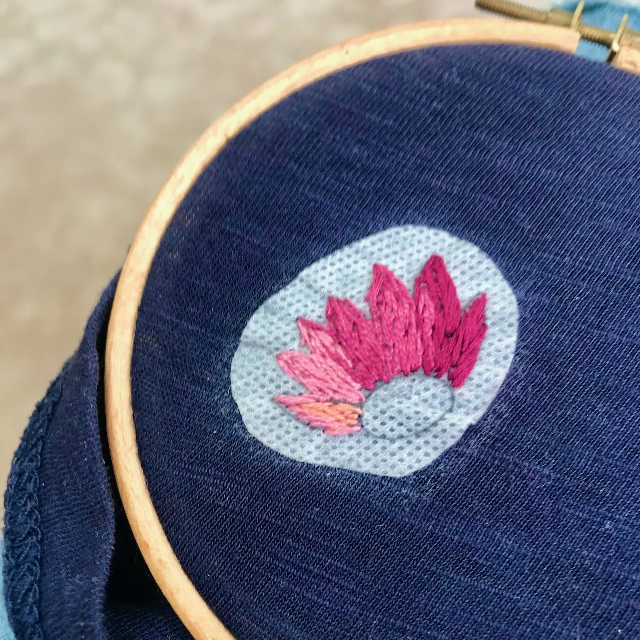 Starting embroidering the petals with deep burgundys through to dusky pinks