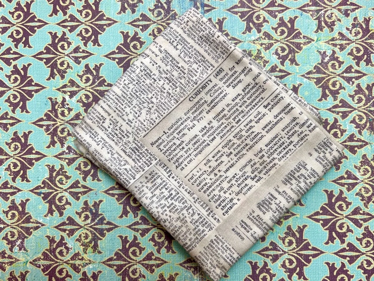 newspaper print on fabric - yes please - the picture shows the dictionary definition of Curiosity