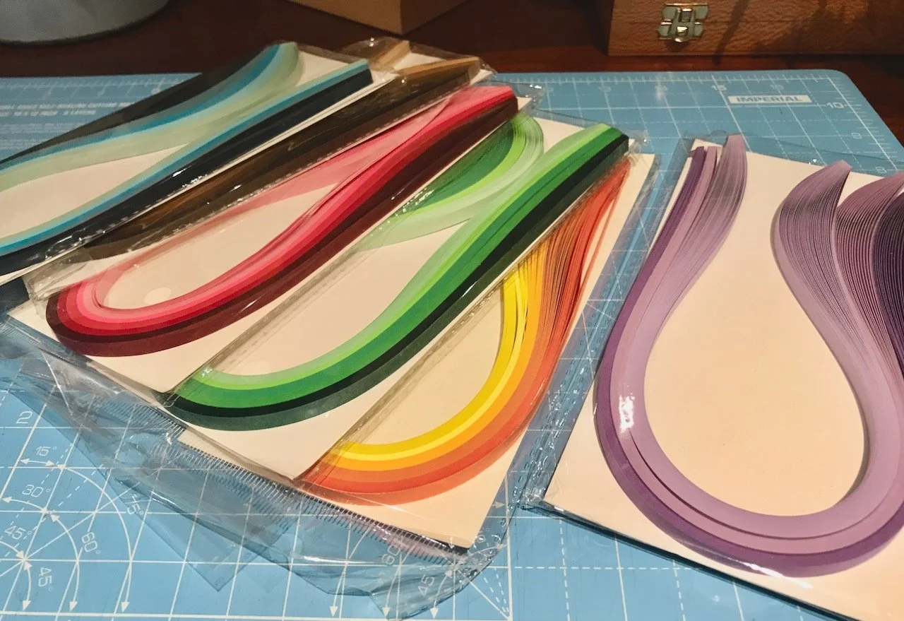 Rainbow tonal packs of strips of coloured paper pre-cut for quilling
