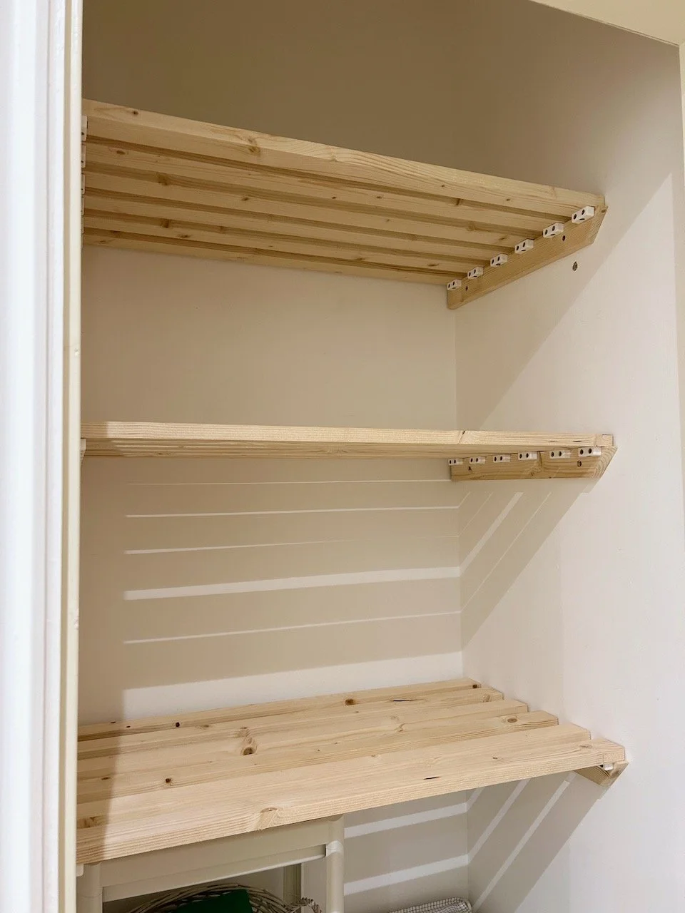 The three completed shelves in my bathroom cupboard