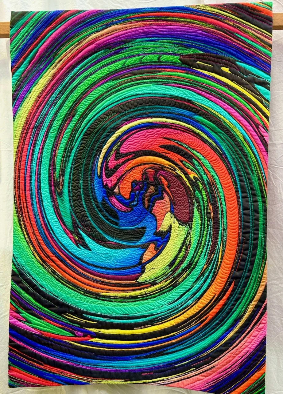 THE RAINBOW COLOURS SWIRL AROUND IN A SINGLE CIRCULAR PATTERN