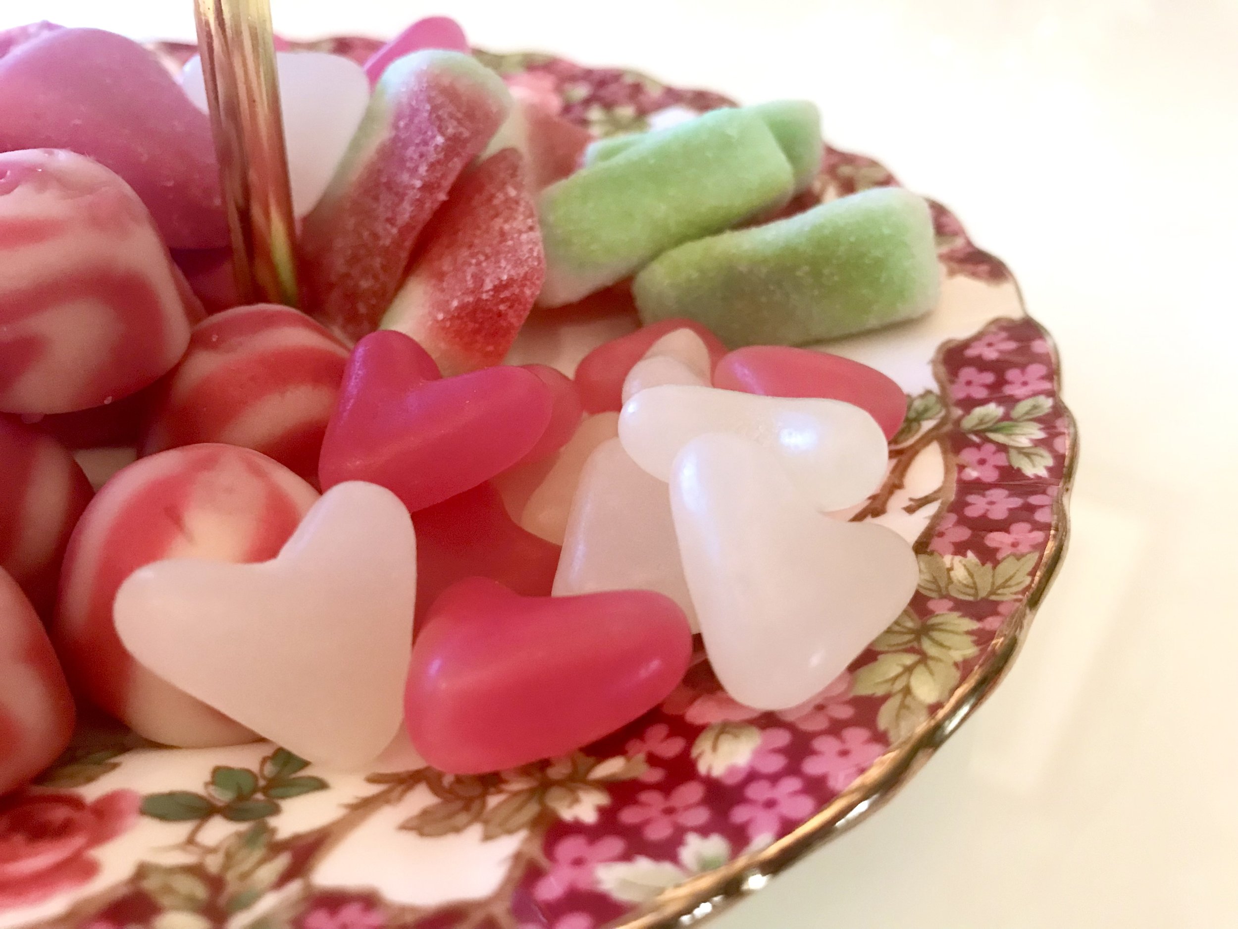 A closer look at the sweets on the lower tier including jelly bean hearts and fizzy watermelon slices
