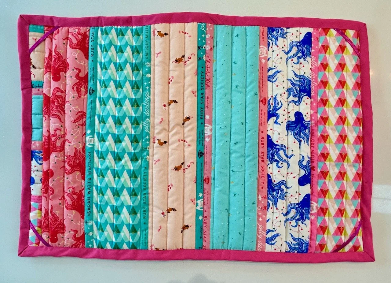 The striped finished back with a strip design, quilted in straight lines