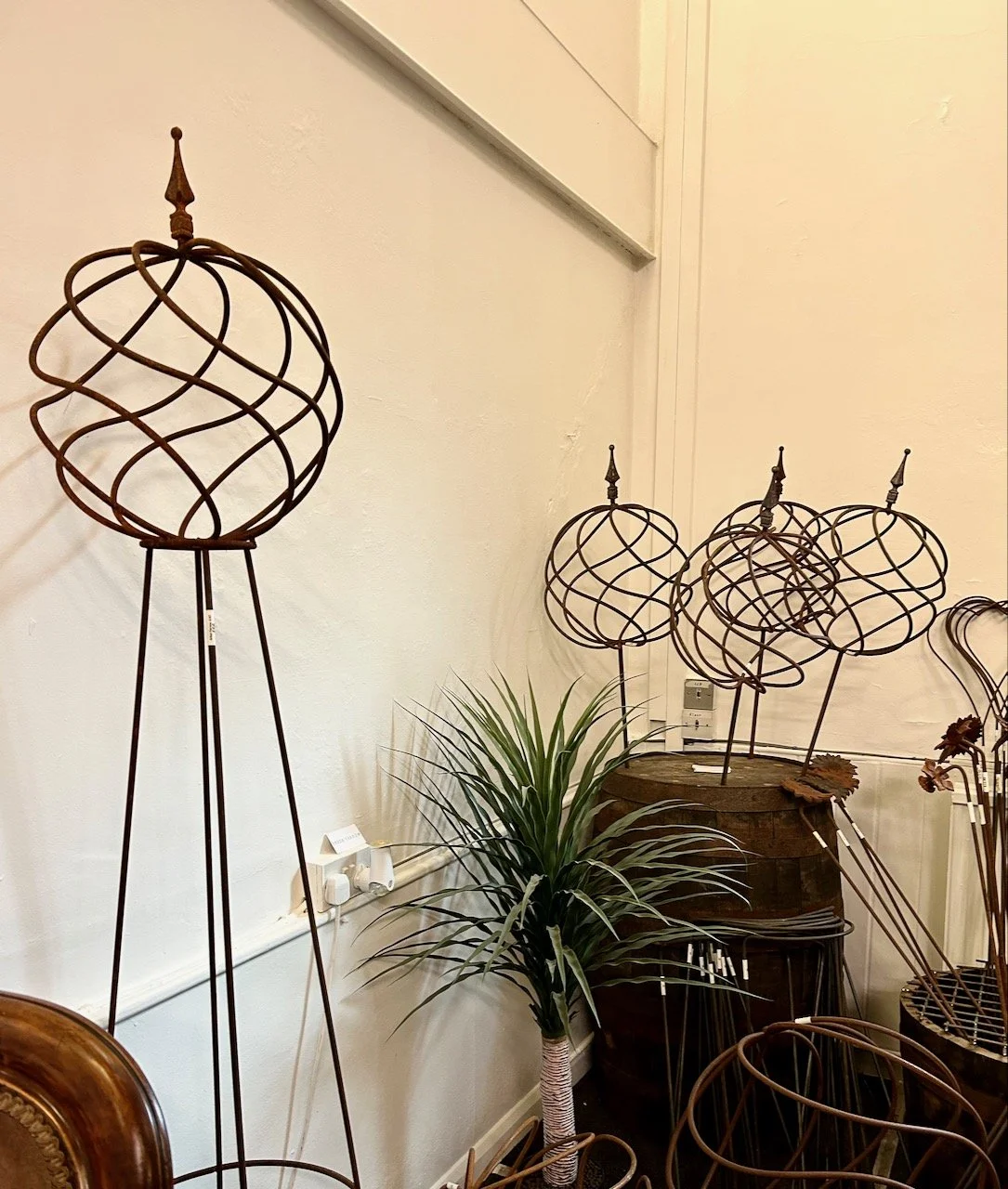 iron garden ornaments, both freestanding on spiked globes