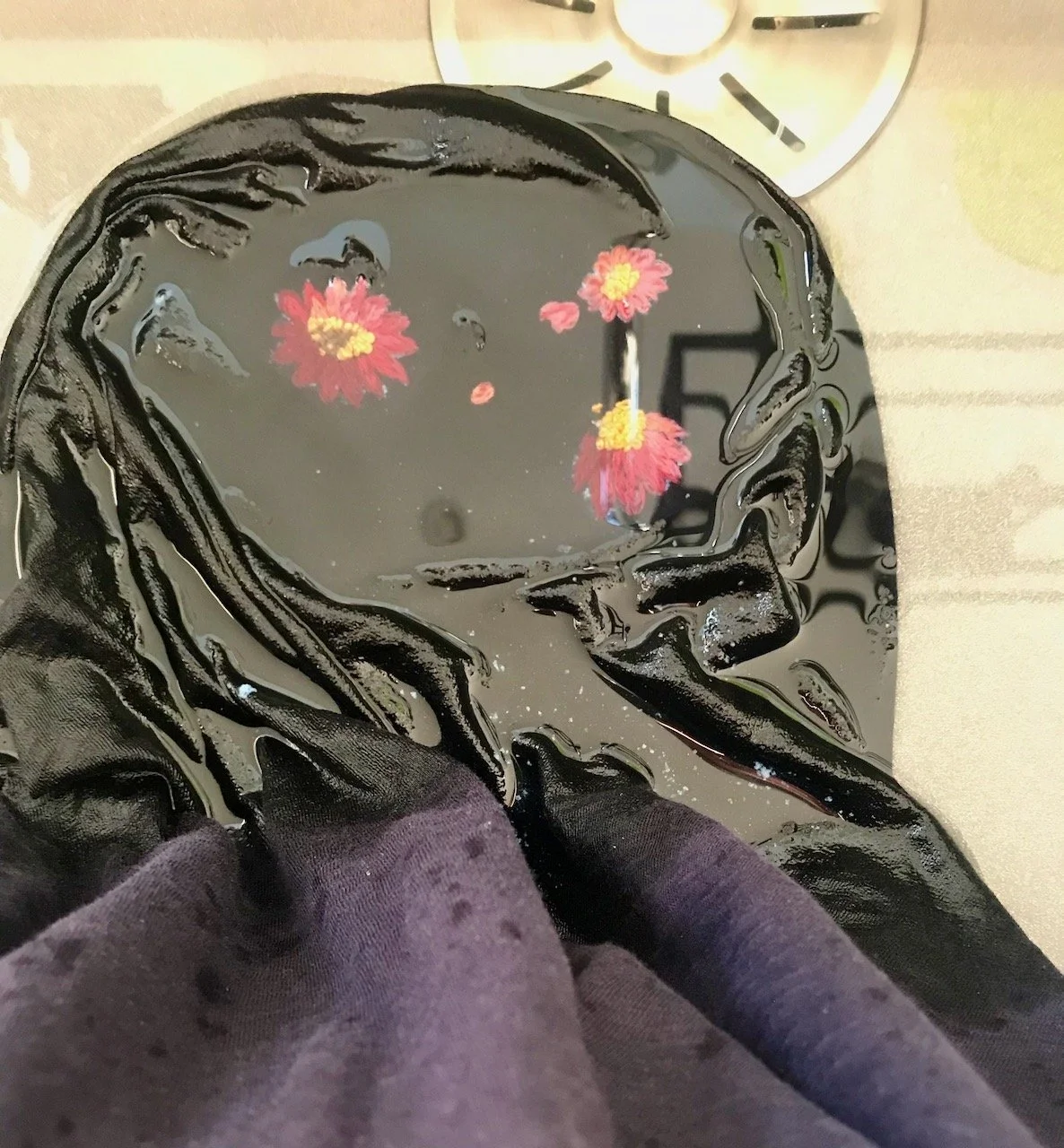 Washing off the template material in cold water - starting to reveal the finished embroidery