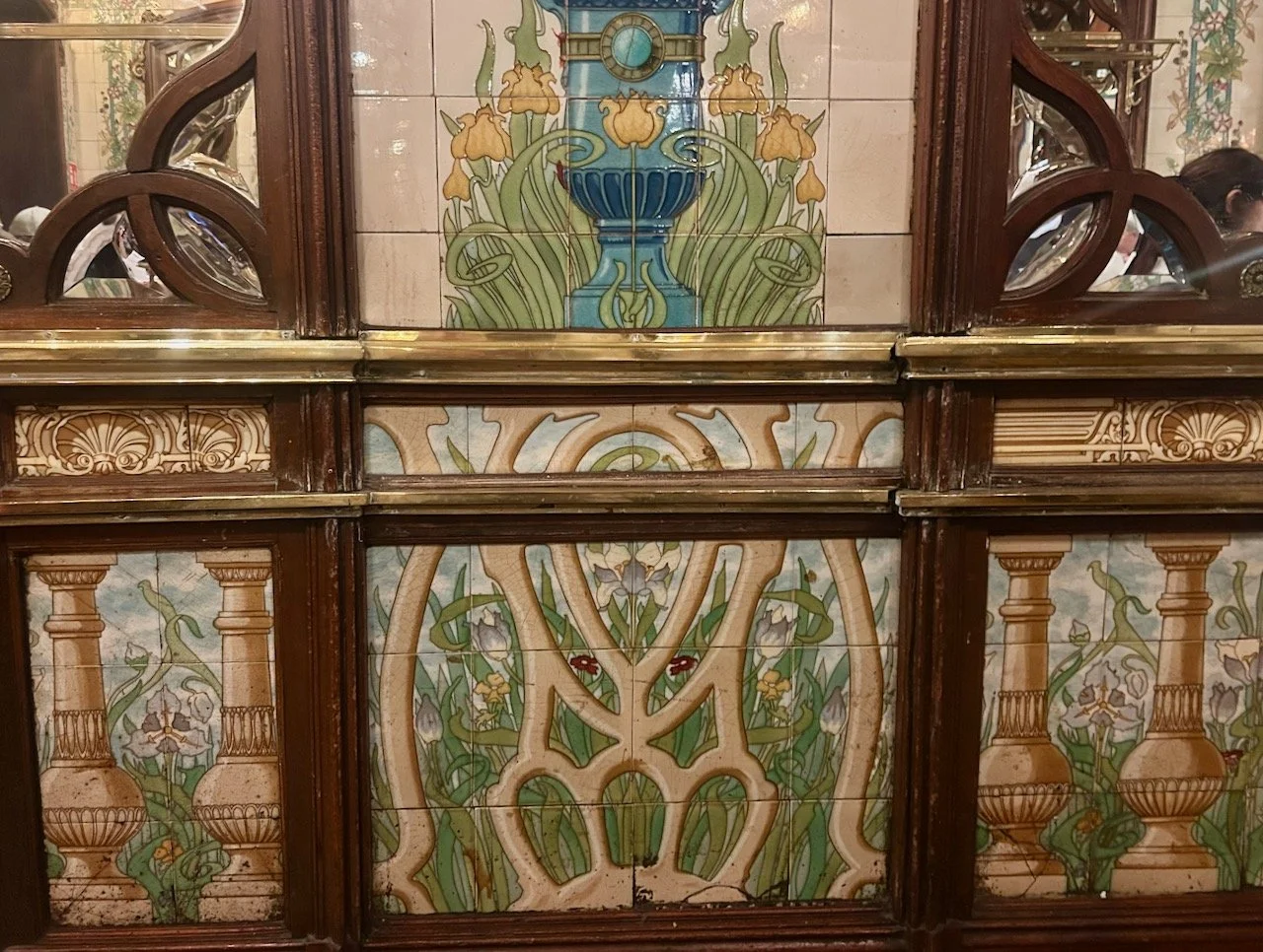 More art deco tiles and glimpses of the carved wooden mirrors