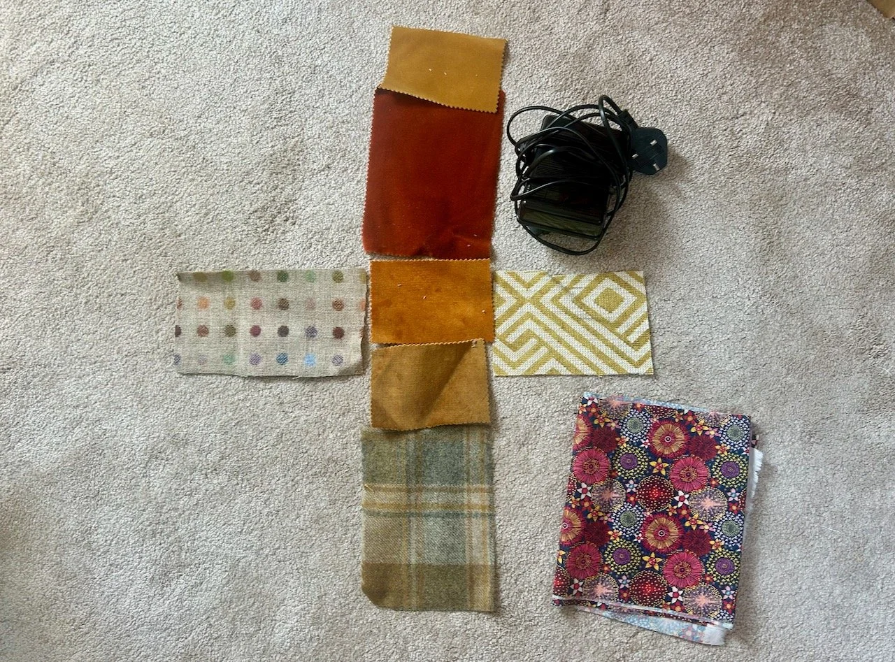Laying out the upholstery samples, the lining and the sewing machine pedal
