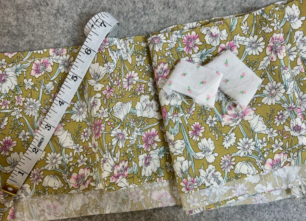 6 inches cut off the skirt length and about an inch from the straps - I'll adjust the pattern next time round