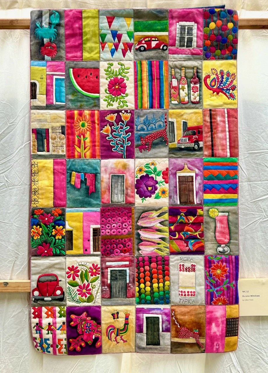 Evolve, Mexican Red by Gillian Travis shows blocks of individual items/travel memories sewn together to create a colourful travel memory quilt