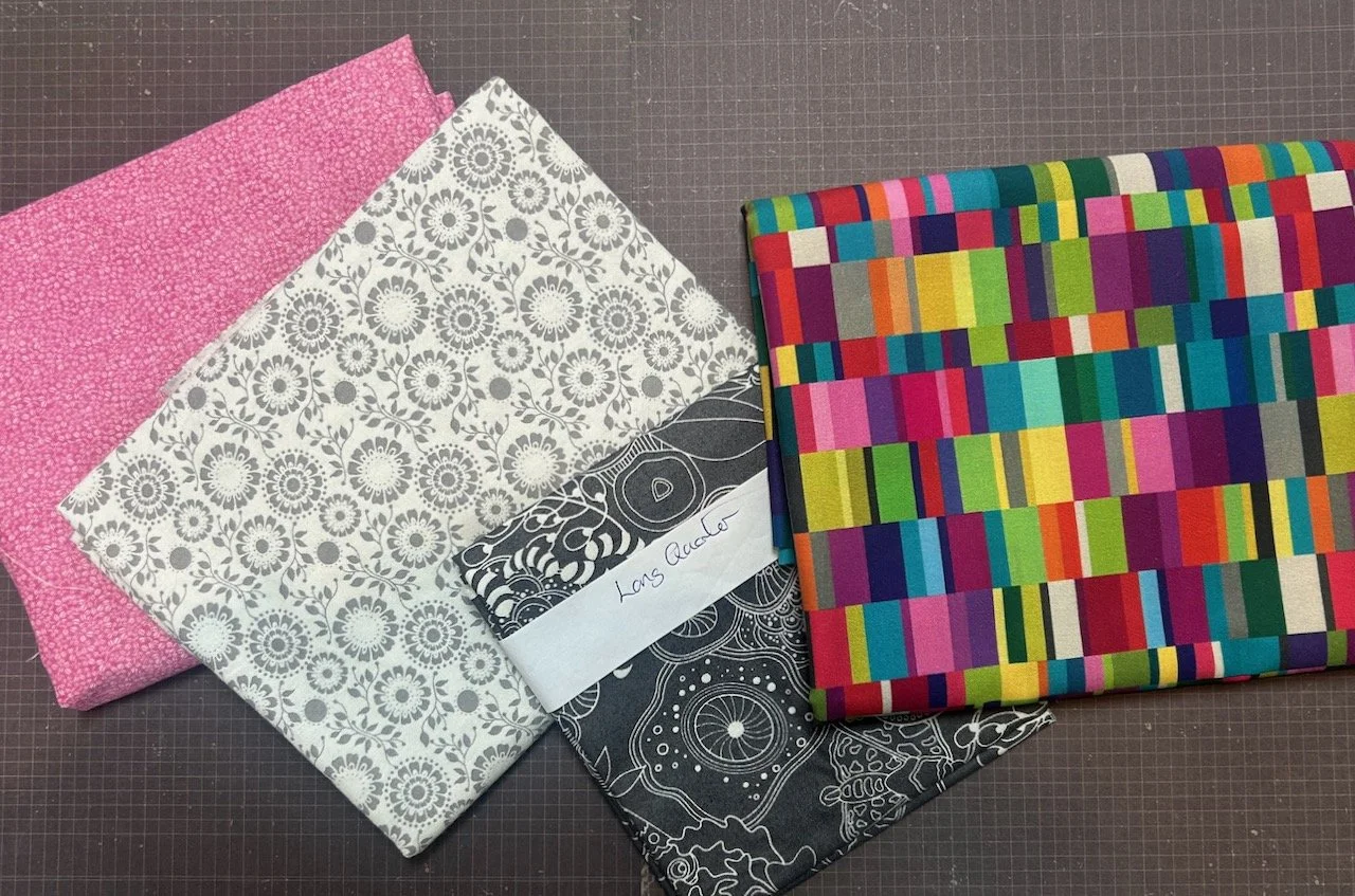 A low volume pink fabric, two more for my grey collection and a brightly patterned fabric I fell hard for