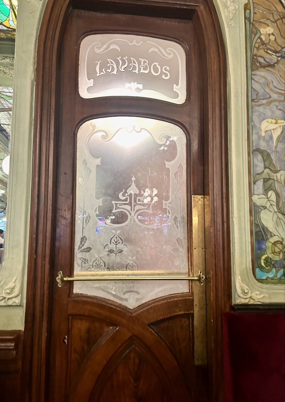 This way through the highly ornate door to the Lavabos