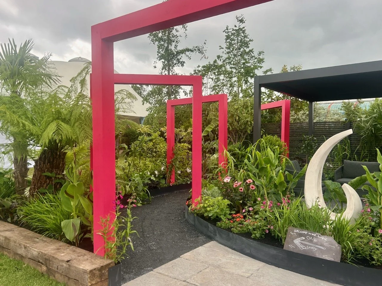 The bold pink square arches which lead you through the garden