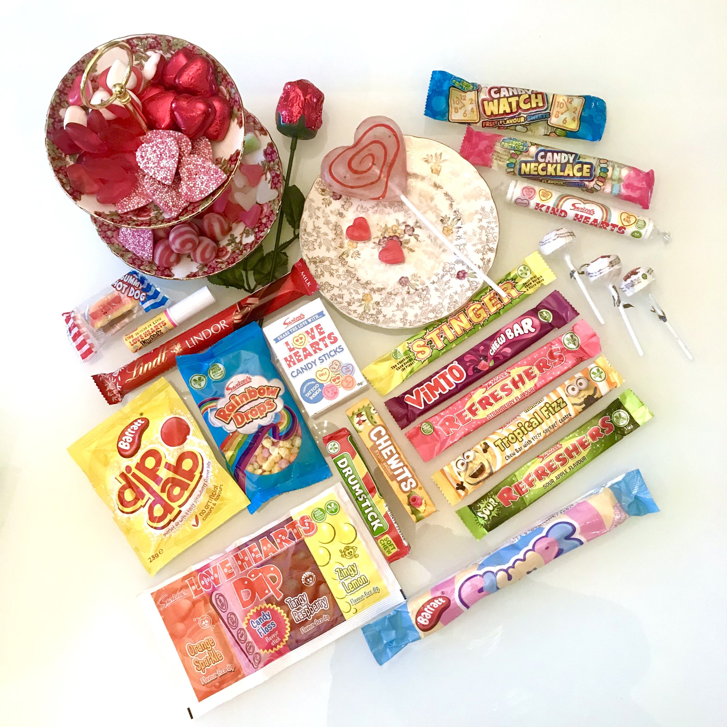 Alongside the sweets already mentioned are other sweets from the box including a candy necklace, kind hearts, refresher chews, chewits drumstick, dib dab, rainbow drops and love hearts dip