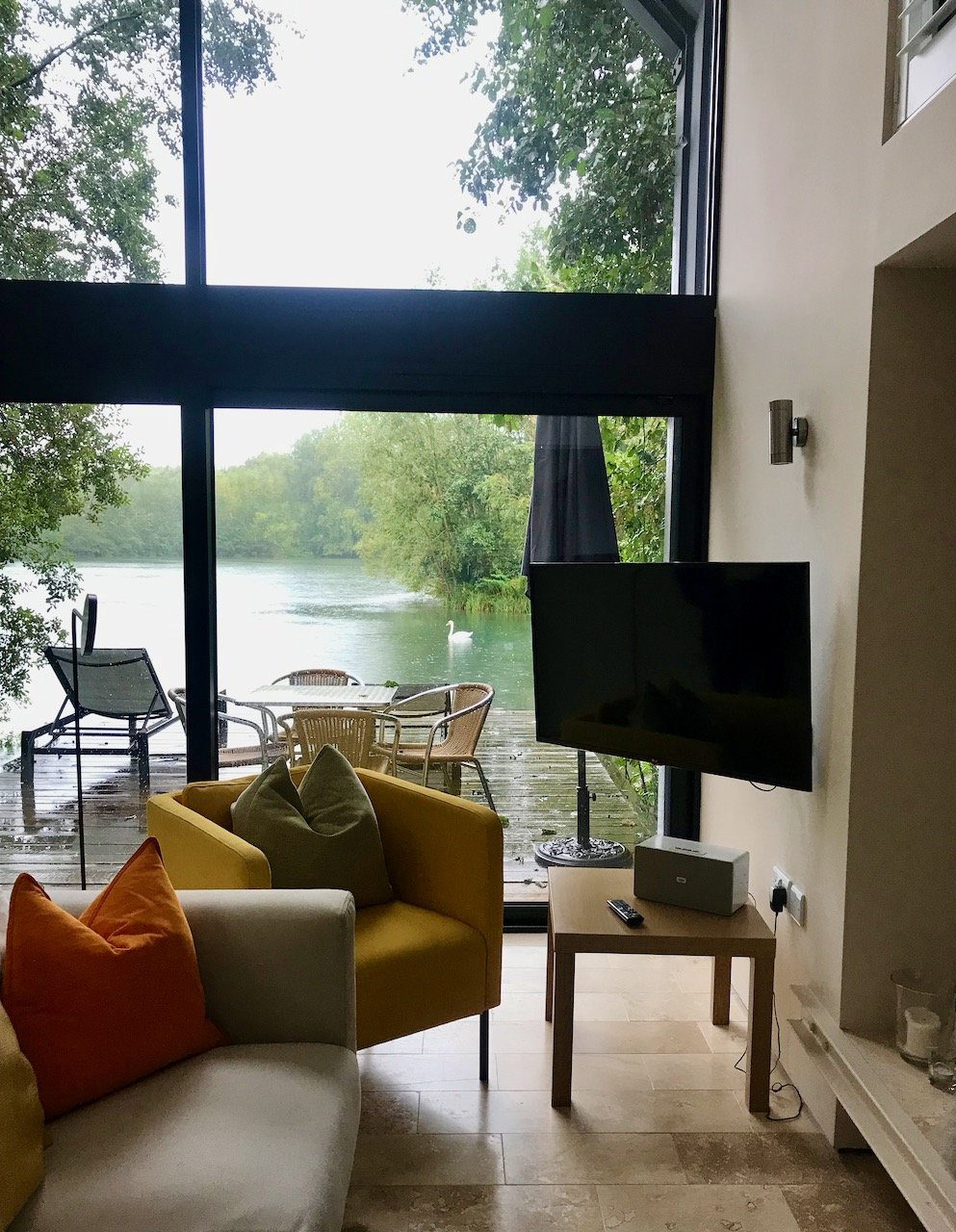 the view of the lake from the open plan living room in the lodge