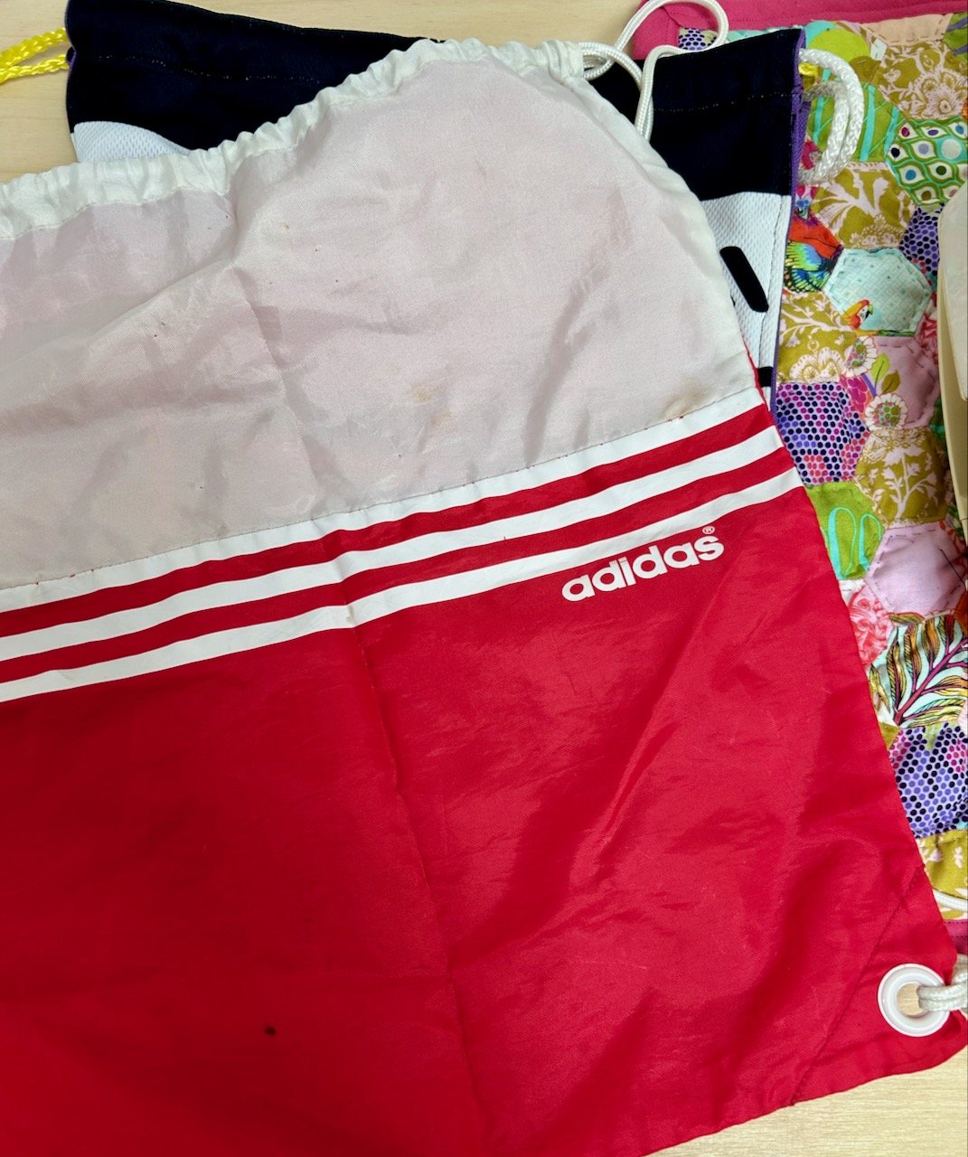 A pink and white adidas drawstring rucksack from my netballing days