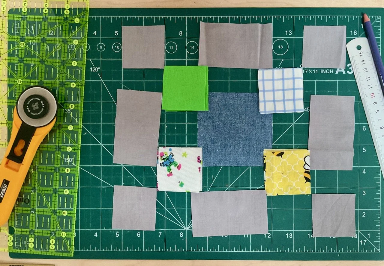 Laying out the components for one of the squares, ready to draw a diagonal line on the small coloured squares