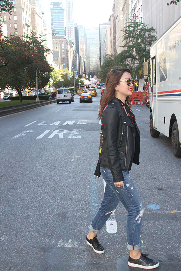 park avenue, central park, new york, nyc, fashion blogger, street fashion, junelemongirl, june lemon girl, black leather jacket, red lace up heels, red heels, kitten heels, love clutch, distressed jeans, printed chiffon blouse, v neck blouse, tie neck blouse, red lips, mirrored sunglasses, autumn fashion, autumn style