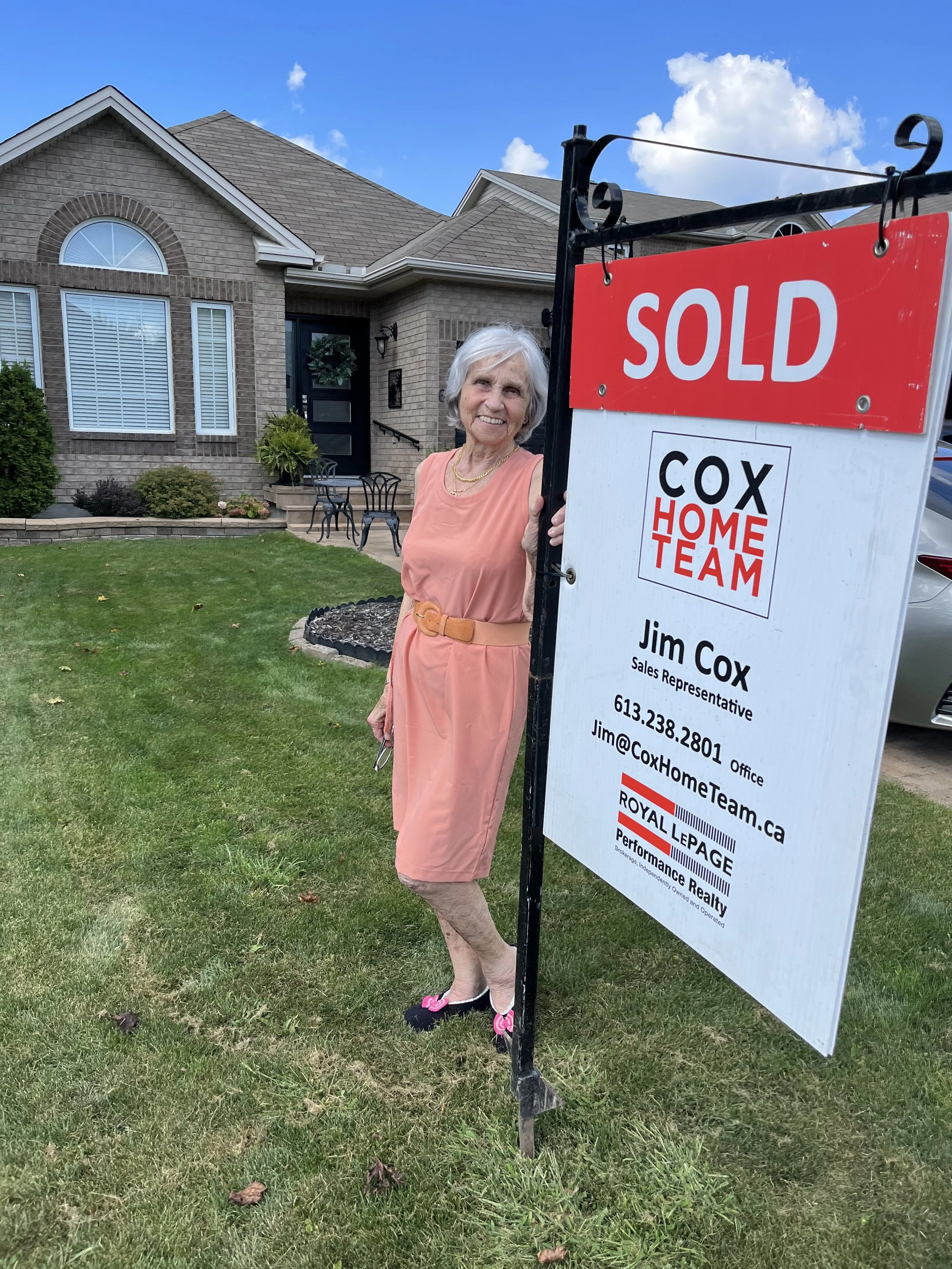 Gloria with sold sign - 62 Denton.jpg