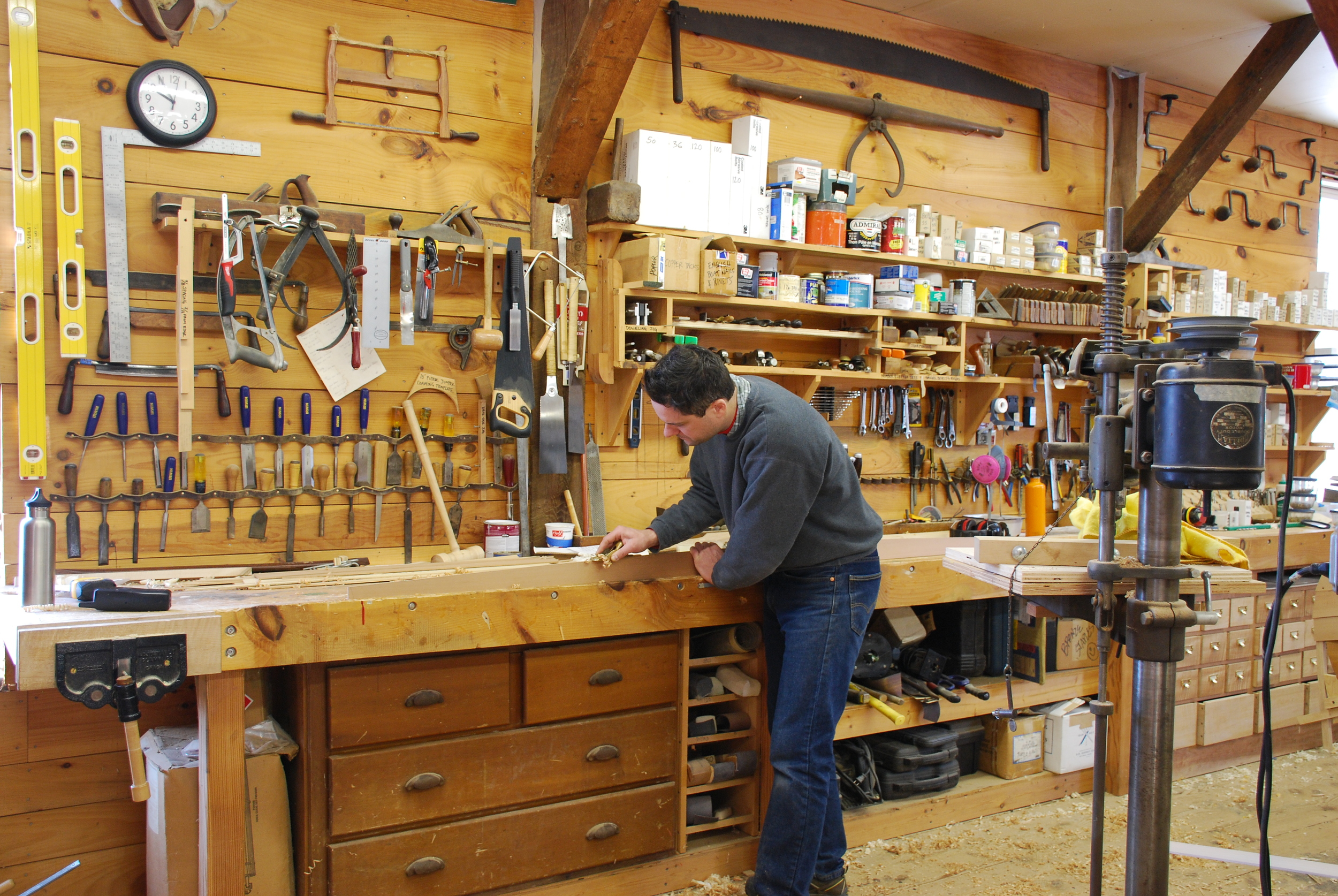 Dylan shaping a section of the goring at the work bench.