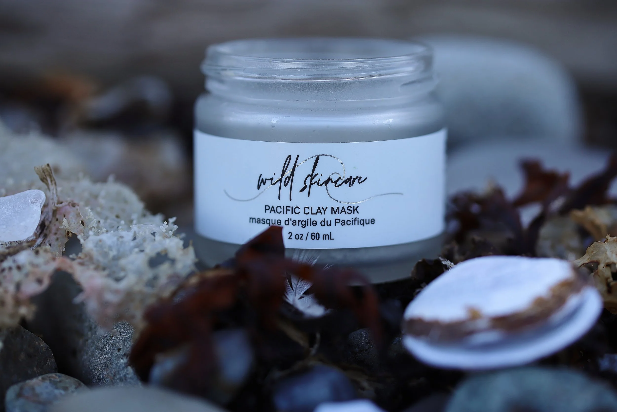 Pacific Clay mask close up with shell and seaweed.JPG