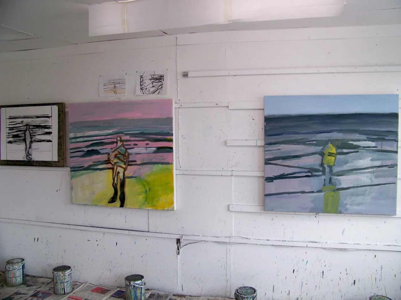 4th May 2012. The studio this morning. Yesterday I was making drawings of two people fishing from the beach; the painting on the right has been adjusted to include one of them. I have put the figure back in the pink painting on the left after discussing the current work with Stephen Walton earlier this week.