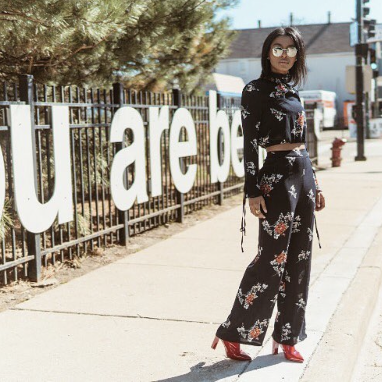 Close-up of the “You Are Beautiful” letters designed by artist Matthew Hoffman, catching light along the Fox River, public art that encourages individuality.