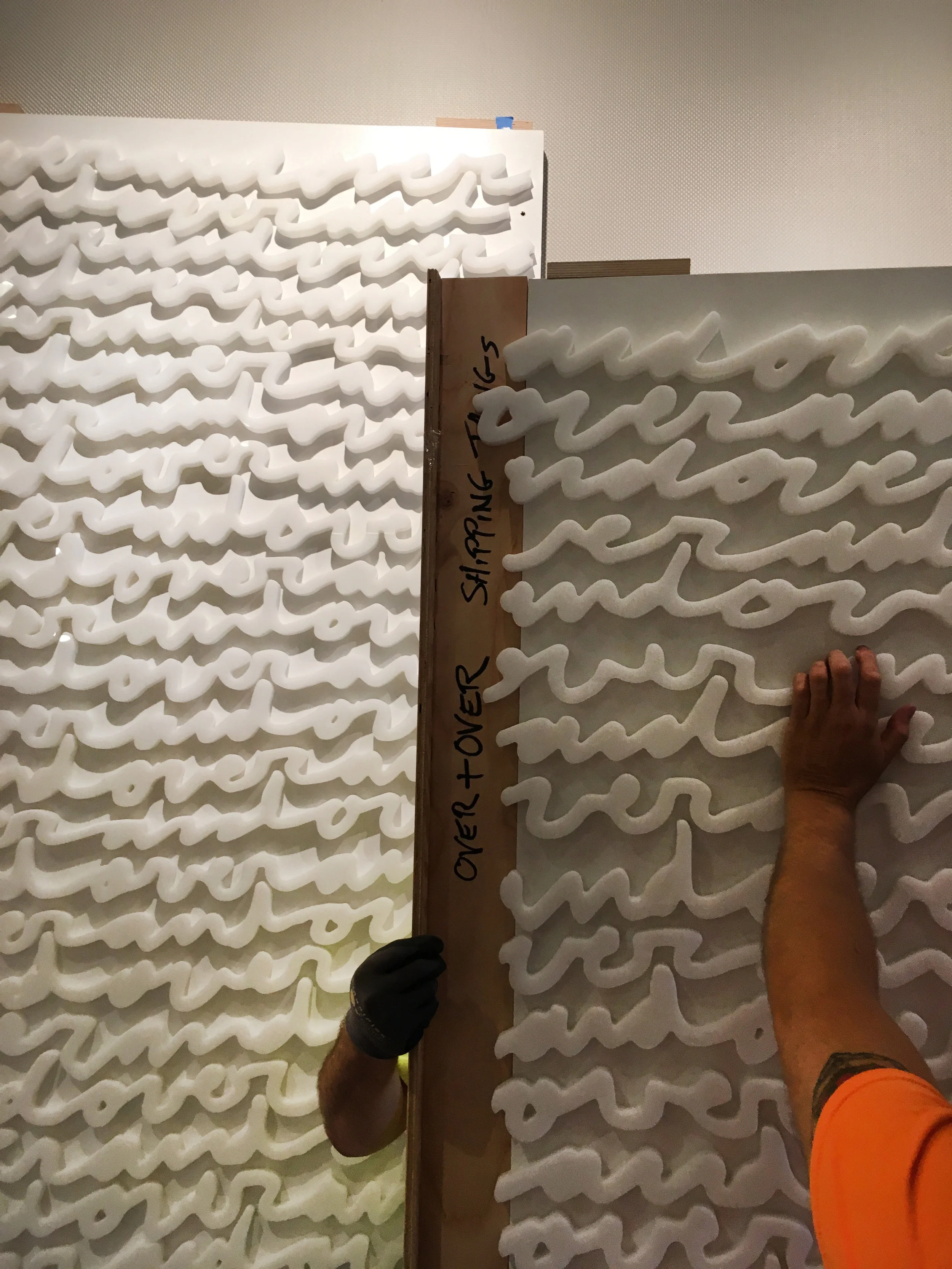 “Over & Over” large-scale white-on-white wall installation by Matthew Hoffman at Hyatt Regency McCormick Place, Chicago.