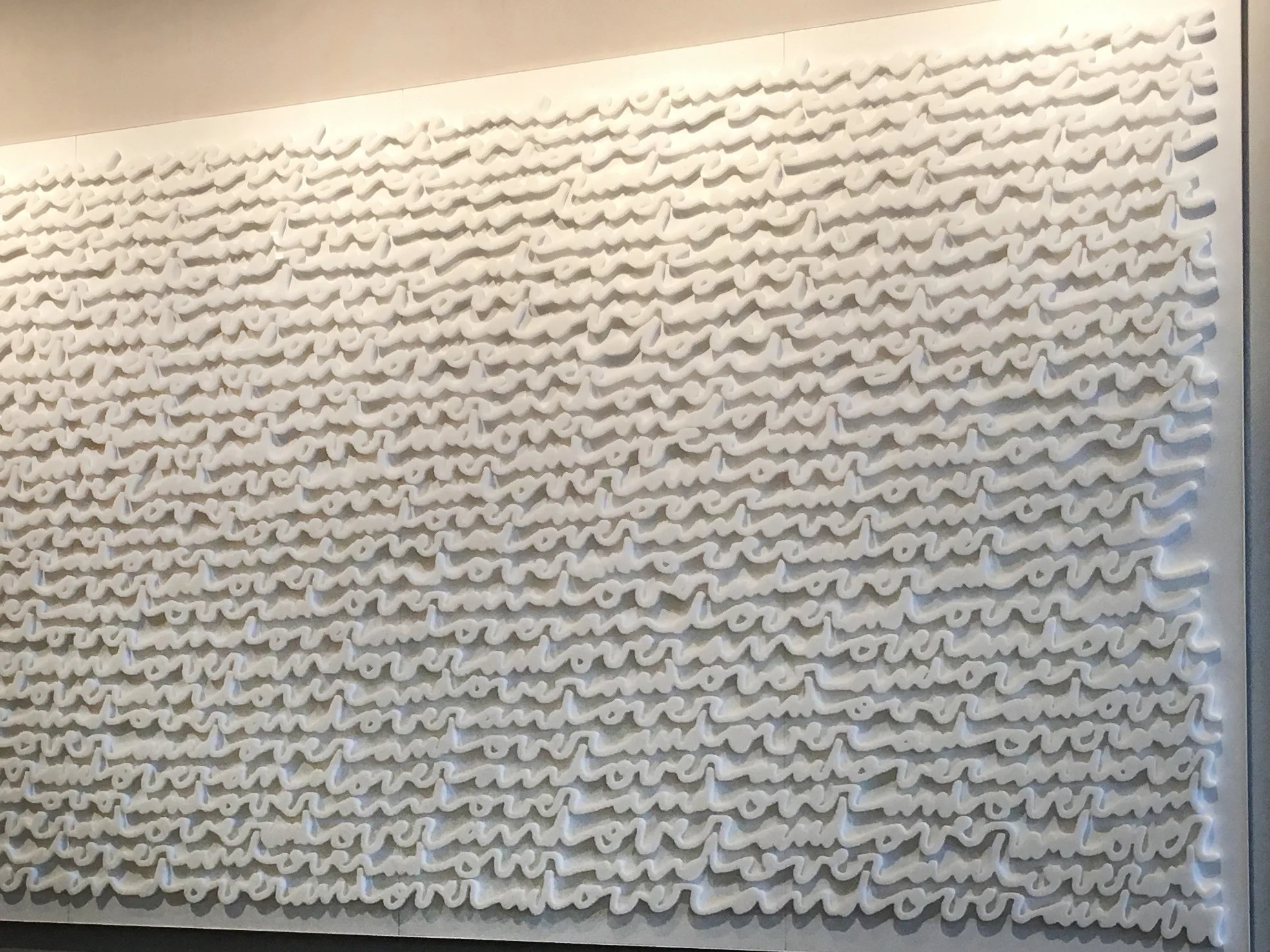 “Over & Over” large-scale white-on-white wall installation by Matthew Hoffman at Hyatt Regency McCormick Place, Chicago.