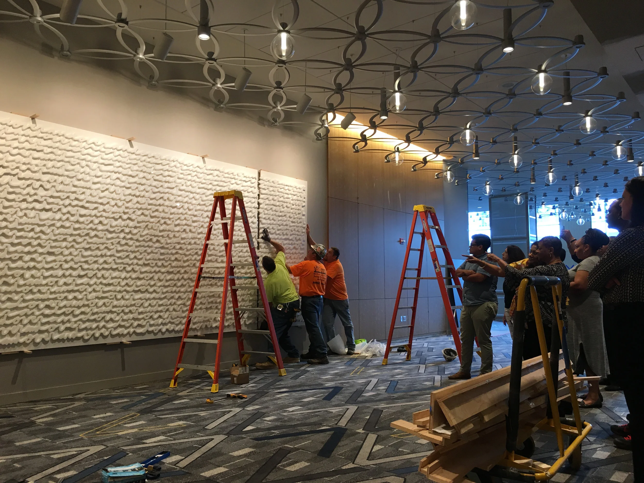 “Over & Over” large-scale white-on-white wall installation by Matthew Hoffman at Hyatt Regency McCormick Place, Chicago.