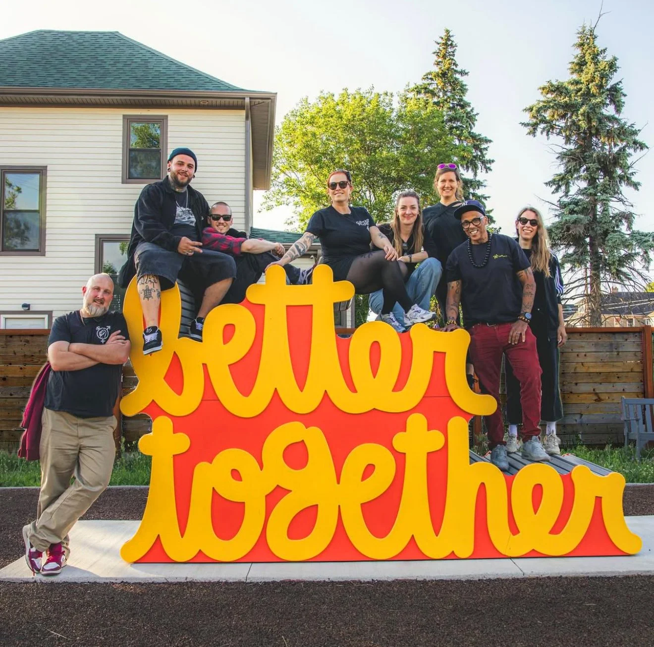 Community members interacting with Matthew Hoffman’s sculpture, an uplifting example of placemaking and the power of public art.